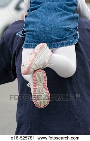 Stock Image - Toddler on back of father. Fotosearch