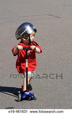 Toddler on scooter View Large Photo Image Stock Image - Toddler on scooter. Fotosearch
