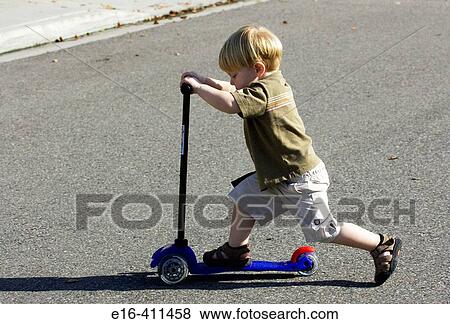 Stock Photo - toddler on scooter. Fotosearch