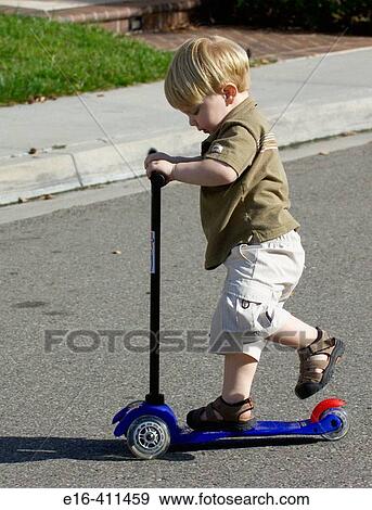 toddler on scooter View Large Photo Image Stock Photo - toddler on scooter. Fotosearch