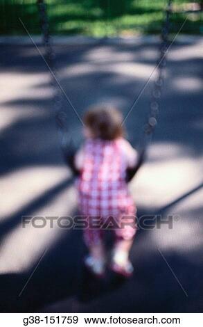 Stock Photo - Toddler on swing. Fotosearch