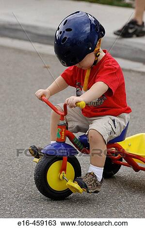 Toddler on tricycle toy View Large Photo Image Stock Image - Toddler on tricycle toy. Fotosearch