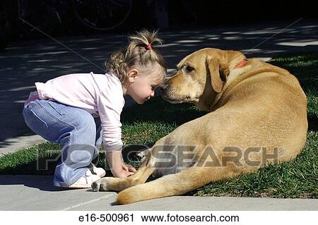 Stock Image - Toddler with dog. Fotosearch