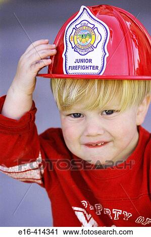 Toddler with fireman's hat View Large Photo Image Stock Image - Toddler with fireman's hat. Fotosearch