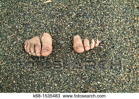 Toes showing from feet buried in sand View Large Photo Image Stock Image - Toes showing from feet buried in sand. Fotosearch