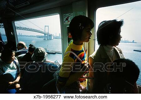Stock Photo - Tokyo. Japan. The Yurikamome electric driverless train links the reclaimed district of Odaiba to the city.. Fotosearch