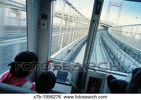 Tokyo. Japan. The Yurikamome electric driverless train links the reclaimed district of Odaiba to the city. View Large Photo Image Stock Photograph - Tokyo. Japan. The Yurikamome electric driverless train links the reclaimed district of Odaiba to the city.. Fotosearch