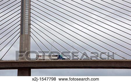 Toledo, Ohio - A truck crosses the cable-stayed bridge that carries Interstate Highway 280 over the Maumee River View Large Photo Image Stock Photo - Toledo, Ohio - A truck crosses the cable-stayed bridge that carries Interstate Highway 280 over the Maumee River. Fotosearch