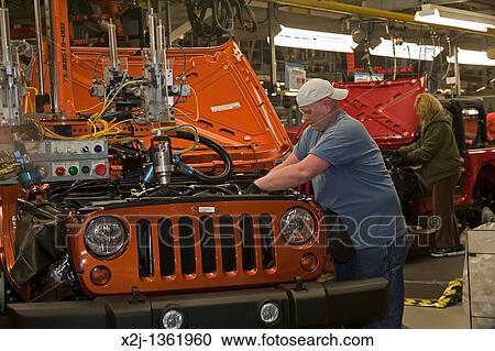 Toledo, Ohio - Workers assemble a Jeep at a Chrysler assembly plant View Large Photo Image Stock Image - Toledo, Ohio - Workers assemble a Jeep at a Chrysler assembly plant. Fotosearch