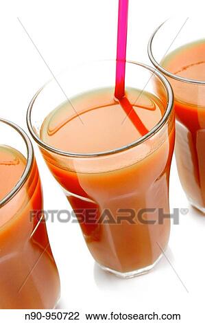 Stock Image - Tomato juice isolated against a white background. Fotosearch