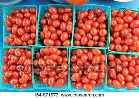 Stock Image - Tomato Tomatoes Produce display at farmer's flea market florida. Fotosearch