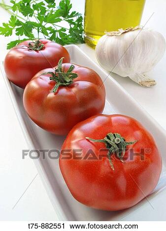 Tomatoes, garlic, olive oil and parsley View Large Photo Image Stock Image - Tomatoes, garlic, olive oil and parsley. Fotosearch