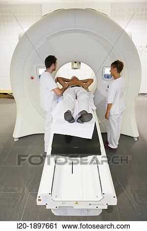 Stock Image - TomoTherapy, Hi-Art, Type of radiation therapy in which the radiation is delivered slice-by-slice hence the use of the Greek prefix tomo-, which means? slice?. Fotosearch
