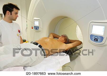 Stock Image - TomoTherapy, Hi-Art, Type of radiation therapy in which the radiation is delivered slice-by-slice hence the use of the Greek prefix tomo-, which means? slice?. Fotosearch