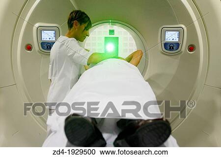 Stock Image - TomoTherapy, Hi-Art, Type of radiation therapy in which the radiation is delivered slice-by-slice hence the use of the Greek prefix tomo-, which means? slice?. Fotosearch