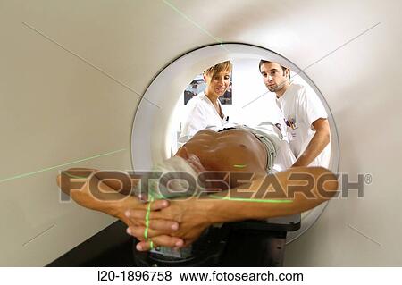 Stock Photo - TomoTherapy, Hi-Art, Type of radiation therapy in which the radiation is delivered slice-by-slice hence the use of the Greek prefix tomo-, which means? slice?. Fotosearch