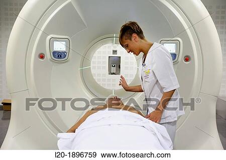 Stock Photo - TomoTherapy, Hi-Art, Type of radiation therapy in which the radiation is delivered slice-by-slice hence the use of the Greek prefix tomo-, which means? slice?. Fotosearch