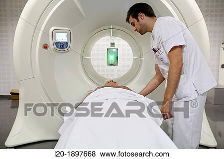 Stock Photo - TomoTherapy, Hi-Art, Type of radiation therapy in which the radiation is delivered slice-by-slice hence the use of the Greek prefix tomo-, which means? slice?. Fotosearch