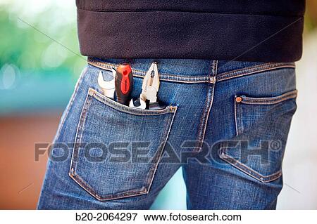 Stock Photo - Tools in jeans pocket. DIY.. Fotosearch
