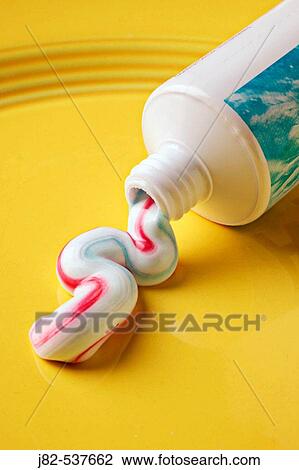 Toothpaste on yellow plate View Large Photo Image Stock Image - Toothpaste on yellow plate. Fotosearch