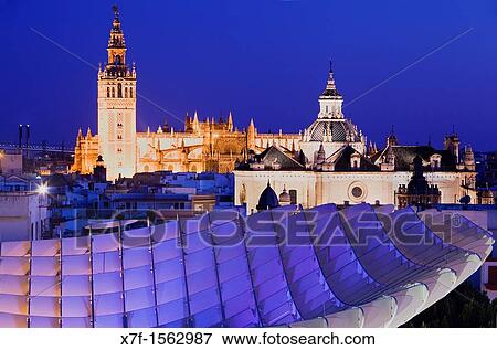 Top of Metropol Parasol and the cathedral, from Plaza de la Encarnaci? n, Sevilla, Andaluc? a, Spain View Large Photo Image Stock Photo - Top of Metropol Parasol and the cathedral, from Plaza de la Encarnaci? n, Sevilla, Andaluc? a, Spain. Fotosearch