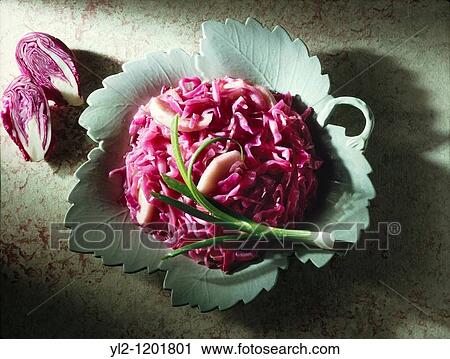 Top shot of shredded red cabbage and apple salad on a grey leaf plate View Large Photo Image Stock Image - Top shot of shredded red cabbage and apple salad on a grey leaf plate. Fotosearch