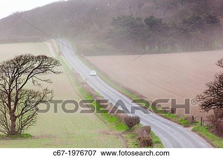 Stock Photo - Top soil blowing from coastal fields during dry weather Sherringham Norfolk.. Fotosearch