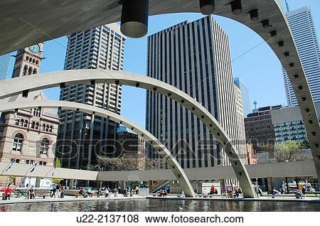 Stock Photo - Toronto Canada: Nathan Phillips Square, urban plaza that forms the forecourt to Toronto City Hallat the intersection of Queen Street West and Bay Street. Fotosearch