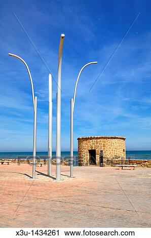 Torre De La Mata watchtower at Plaza Del Embarcadero in Torrevieja, Alicante, Spain View Large Photo Image Stock Image - Torre De La Mata watchtower at Plaza Del Embarcadero in Torrevieja, Alicante, Spain. Fotosearch