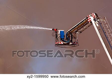 Torremolinos, Malaga Province, Costa del Sol, Spain Fighting fire which burned down The Magic Palace, February 18, 2011 with remote controlled hose on ladder View Large Photo Image Stock Image - Torremolinos, Malaga Province, Costa del Sol, Spain Fighting fire which burned down The Magic Palace, February 18, 2011 with remote controlled hose on ladder. Fotosearch