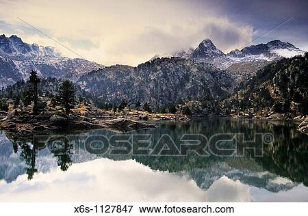 Tort de la Peguera lake, National Park Aig? estortes i Estany de Sant Maurici, Lleida Spain View Large Photo Image Stock Photo - Tort de la Peguera lake, National Park Aig? estortes i Estany de Sant Maurici, Lleida Spain. Fotosearch