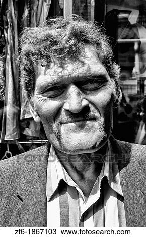 Tough looking giant man with extreme large head in city center in Lviv Ukraine View Large Photo Image Stock Image - Tough looking giant man with extreme large head in city center in Lviv Ukraine. Fotosearch