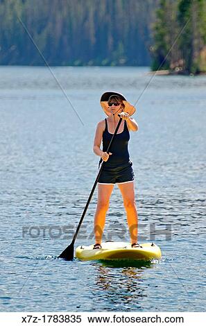 Stock Photography - touring on the Stand Up Paddle Board at Redfish Lake in the Sawtooth Mountains near the town of Stanely in central Idaho. Fotosearch