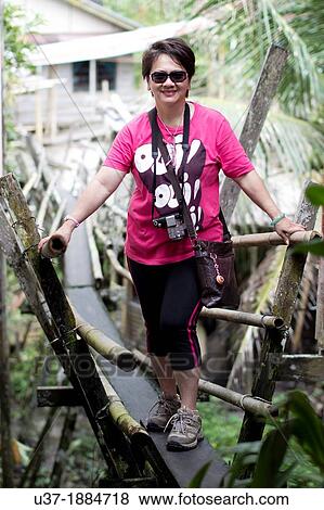 Tourist at Annah Rais longhouse, Sarawak, Malaysia. View Large Photo Image Stock Photo - Tourist at Annah Rais longhouse, Sarawak, Malaysia.. Fotosearch