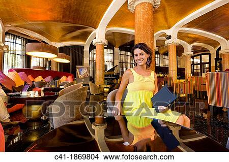Picture - Tourist at the bar of the Hotel Casa Fuster, Barcelona, Spain. Fotosearch