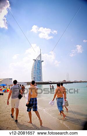 Tourist at the beach, Burj Al Arab hotel. Dubai, United Arab Emirates View Large Photo Image Stock Photo - Tourist at the beach, Burj Al Arab hotel. Dubai, United Arab Emirates. Fotosearch