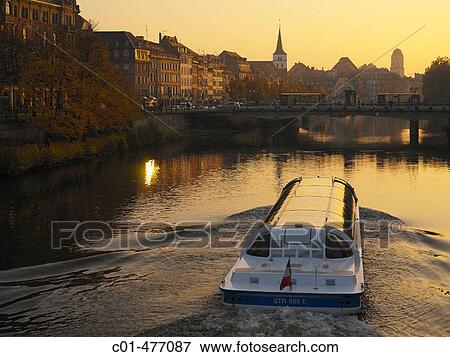 Tourist boat on Ill river at sunset. Strasbourg. Alsace. France. View Large Photo Image Stock Photo - Tourist boat on Ill river at sunset. Strasbourg. Alsace. France.. Fotosearch