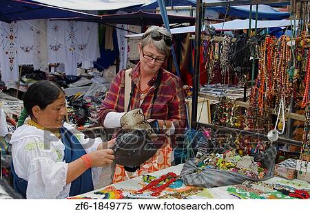 Tourist buying jewelry souvenirs in small village of Otavalo Ecuador South America View Large Photo Image Stock Photography - Tourist buying jewelry souvenirs in small village of Otavalo Ecuador South America. Fotosearch