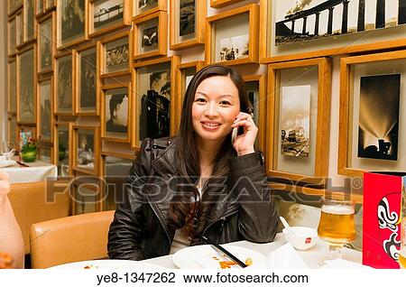 Tourist calling in a Sichuan cuisine restaurant, Haiyongxiang District, Shanghai, China, Asia MR View Large Photo Image Stock Image - Tourist calling in a Sichuan cuisine restaurant, Haiyongxiang District, Shanghai, China, Asia MR. Fotosearch