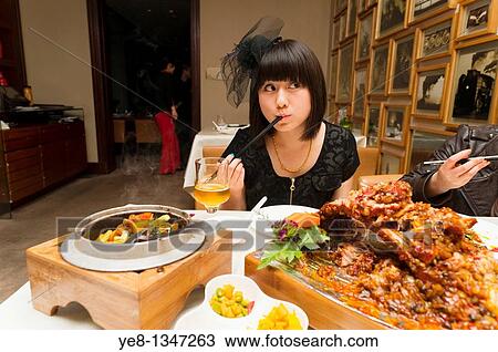 Tourist eating in a Sichuan cuisine restaurant, Haiyongxiang District, Shanghai, China, Asia MR View Large Photo Image Stock Image - Tourist eating in a Sichuan cuisine restaurant, Haiyongxiang District, Shanghai, China, Asia MR. Fotosearch