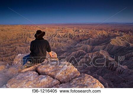 Tourist enjoying a quiet evening overlooking eroded hills of the Borrego Badlands, Fonts Point, Anza Borrego Desert State Park, San Diego County, California View Large Photo Image Stock Photography - Tourist enjoying a quiet evening overlooking eroded hills of the Borrego Badlands, Fonts Point, Anza Borrego Desert State Park, San Diego County, California. Fotosearch