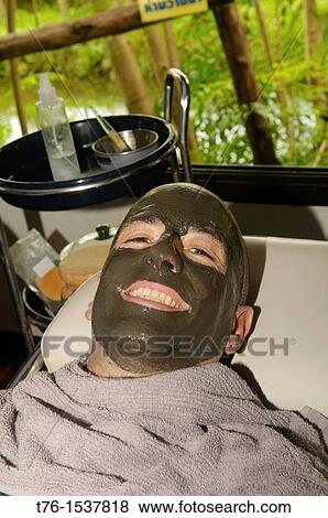 tourist enjoying a therapeutic mud treatment at the Phu Klon Mud Spa in Mae Hong Son, Thailand View Large Photo Image Stock Photo - tourist enjoying a therapeutic mud treatment at the Phu Klon Mud Spa in Mae Hong Son, Thailand. Fotosearch