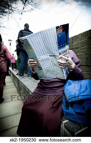 Tourist holding a map of London, near thames river. London, UK View Large Photo Image Stock Image - Tourist holding a map of London, near thames river. London, UK. Fotosearch
