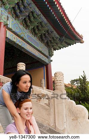 Tourist hugging her friend in The Forbidden City, Beijing, China, Asia MR View Large Photo Image Stock Image - Tourist hugging her friend in The Forbidden City, Beijing, China, Asia MR. Fotosearch
