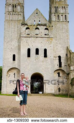 Stock Image - tourist in front of Abbey of Jumieges, Normandy, France. Fotosearch