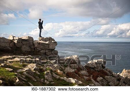 Tourist in Point du Raz, France View Large Photo Image Stock Image - Tourist in Point du Raz, France. Fotosearch