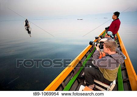 Picture - Tourist in the boat on Inle Lake ( Model released ). Fotosearch