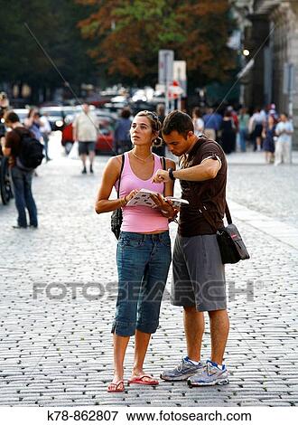 Stock Photo - Tourist in the Old Town Square looking at a map Prague, Czech Republic. Fotosearch