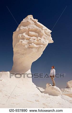 Tourist in White Desert National Park, Libyan Desert, Egypt View Large Photo Image Stock Image - Tourist in White Desert National Park, Libyan Desert, Egypt. Fotosearch