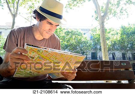 Tourist looking at map View Large Photo Image Picture - Tourist looking at map. Fotosearch